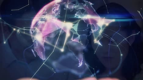animation of globe and shapes over asian woman using smartphone