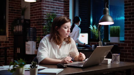 weary accountant struggling to remain awake in office while inputting data