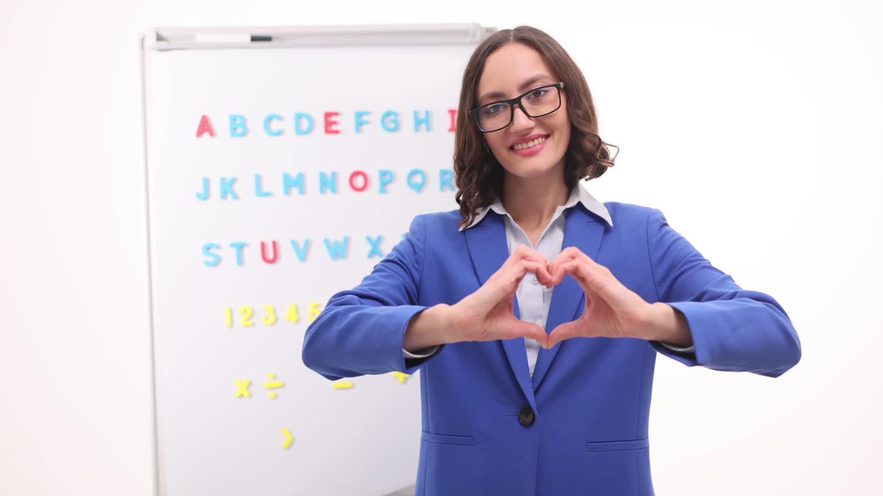 Teacher showing sign language in the classroom