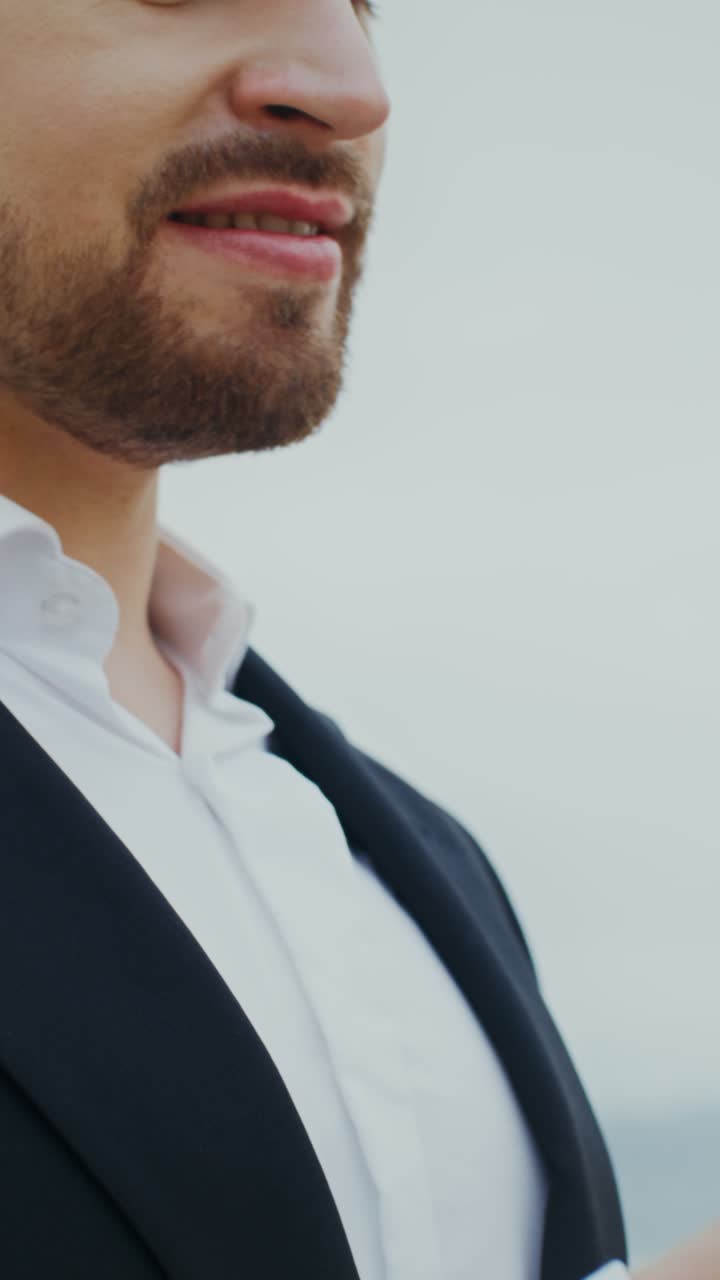 Man in Suit Reading a Document