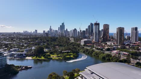 drone footage captures the vibrant skyline and waterways of gold coast, australia, under clear blue skies
