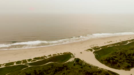 Drone-shot-of-the-ocean's-coastline-in-Florence,-Oregon-near-Jessie-M