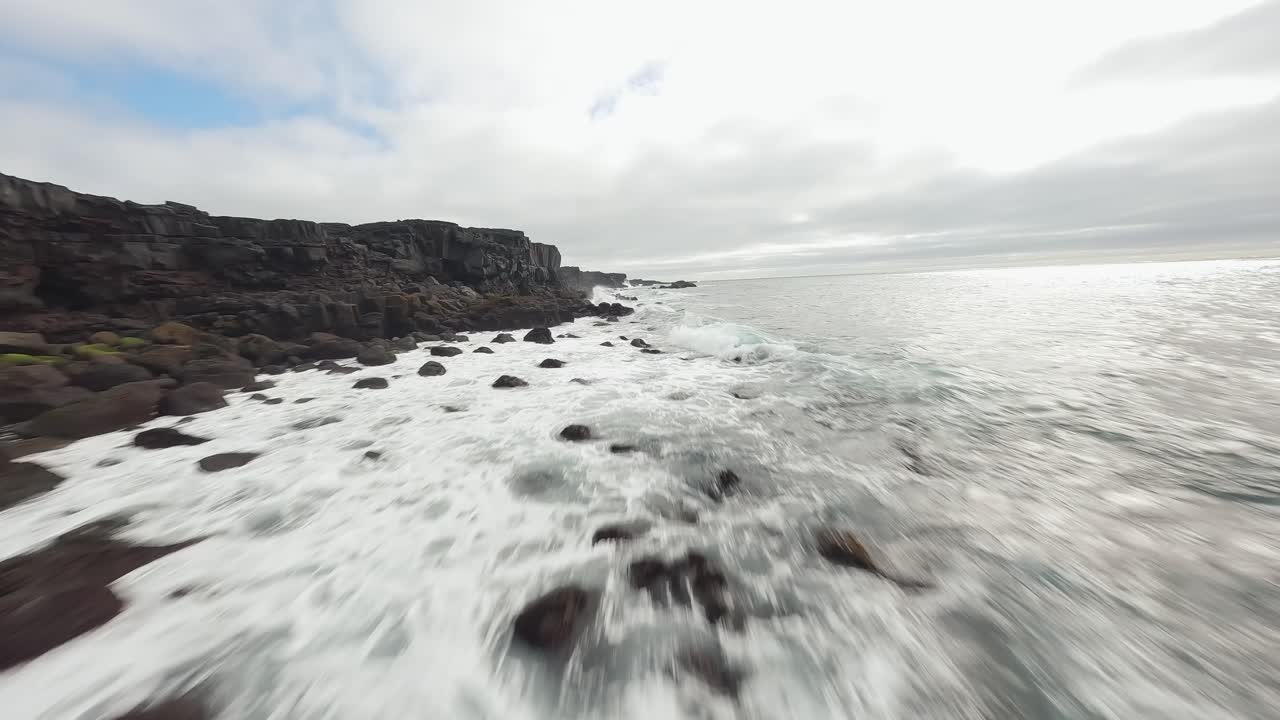 A slow-motion FPV drone flight showcasing Iceland’s dramatic and untamed coastline, with waves crashing against volcanic cliffs