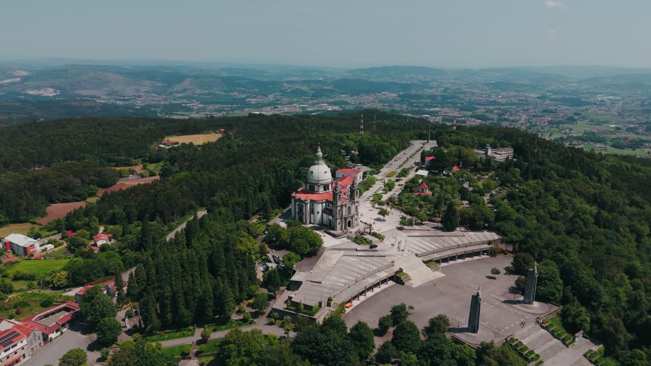 aerial view of sameiro sanctuary surrounded by lush trees and hills in braga portugal