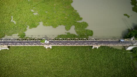 Areal-view-of-vehicles-passing-on-a-bridge