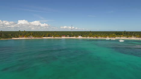 aerial drone view towards the mano juan village, on saona island, in dominican republic