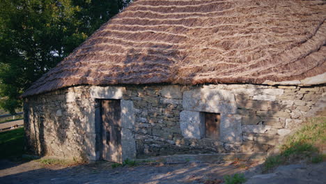 palloza from o cebreiro in galicia medium shot of a door slow motion