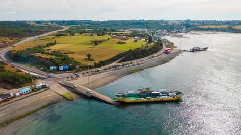 Aerial-orbital-Timelapse-showing-a-ferry-loading-cars-on-the-Chacao-Channel