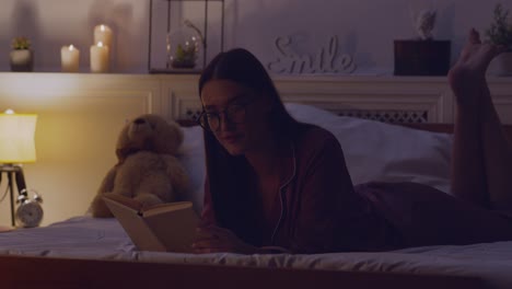 woman reading in bed at night