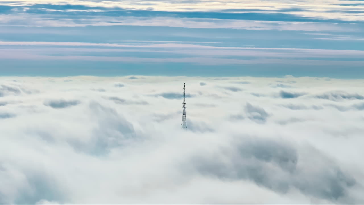 Aerial drone view of an utility pole in the clouds