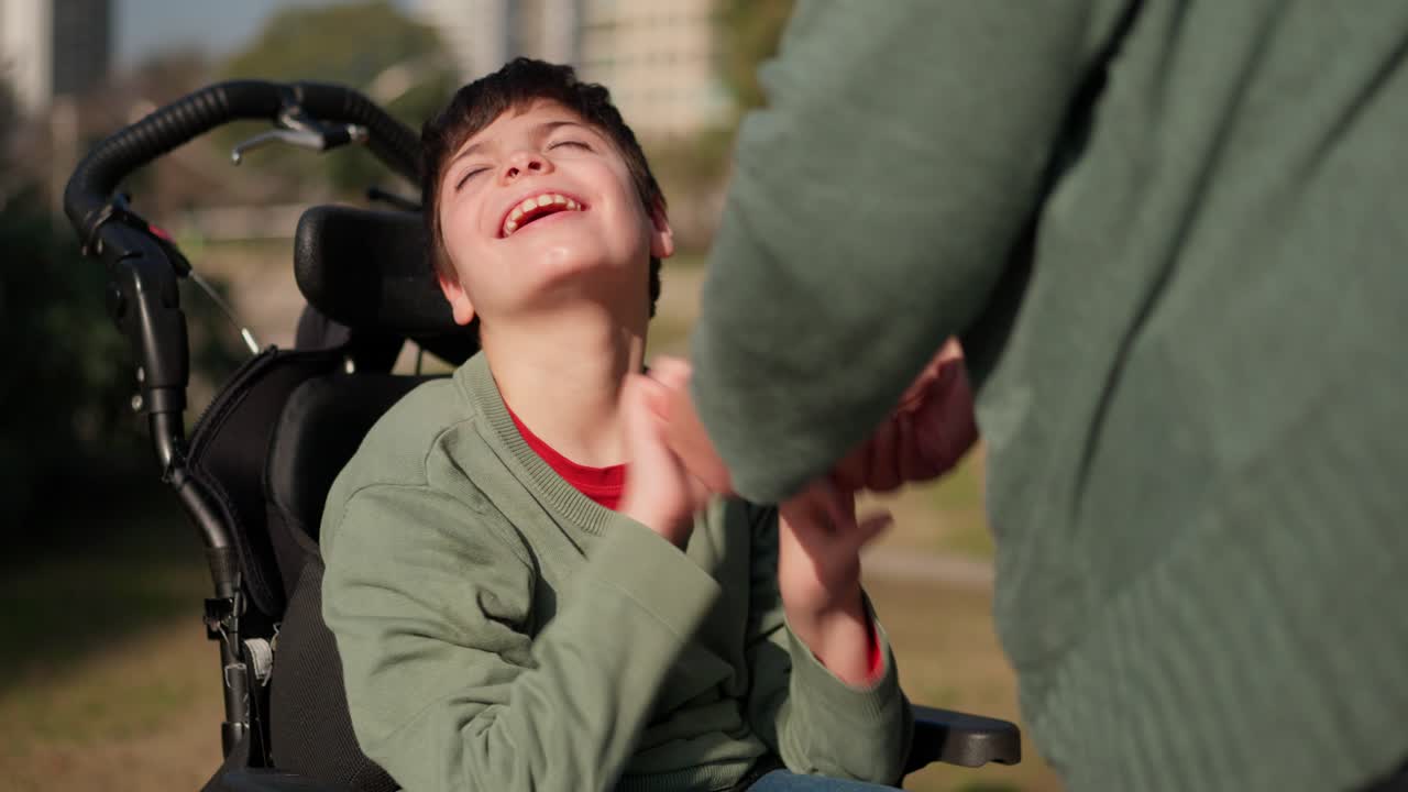 Child in Wheelchair with Caregiver