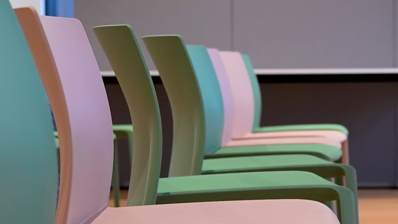 Chairs arranged before a meeting in London, United Kingdom, capturing organisation, preparation, and atmosphere of a professional gathering space