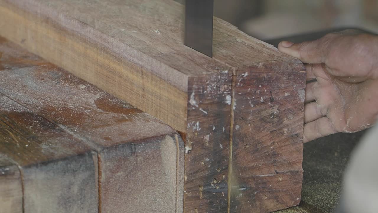Hand Sawing Wood