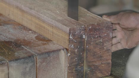 hand sawing wood
