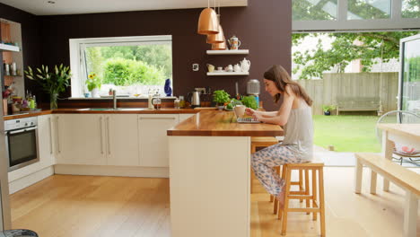 woman working from home in a modern kitchen