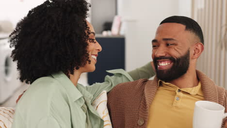 Black-couple,-smile-and-relax-on-sofa-together