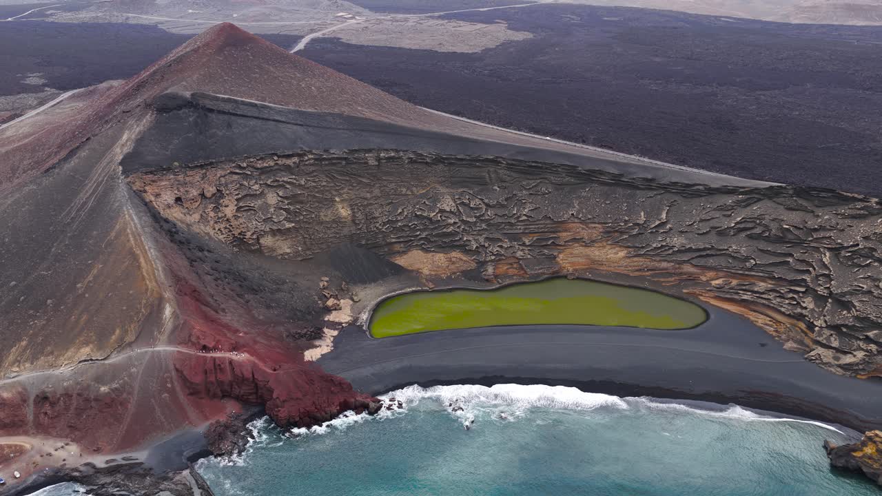 Aerial view of El Golfo crater, vibrant colors, striking landscape