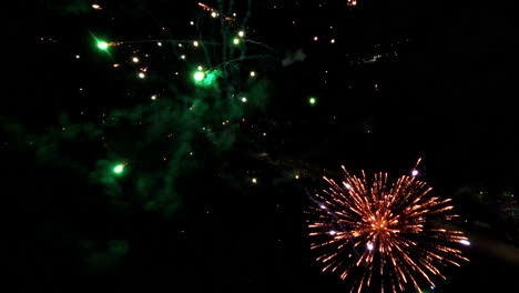 vibrant fireworks burst in night sky, creating a festive, dazzling display