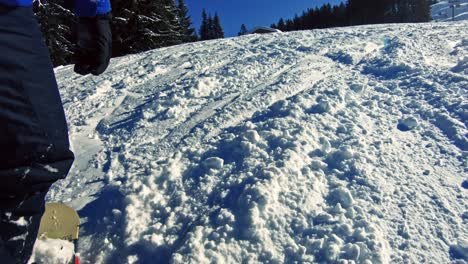 Male-snowboarder-going-down-the-slope