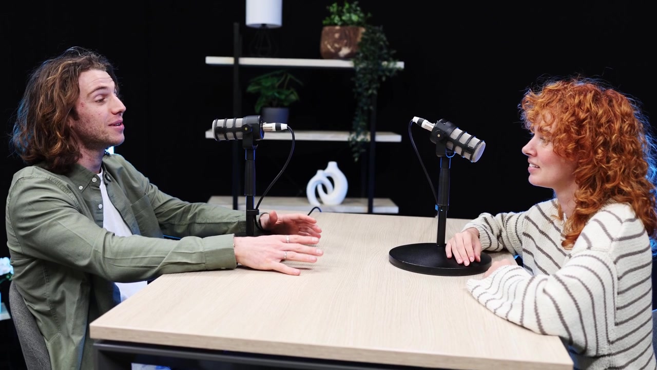 Young Man and Woman Discussing on a Podcast in a Studio