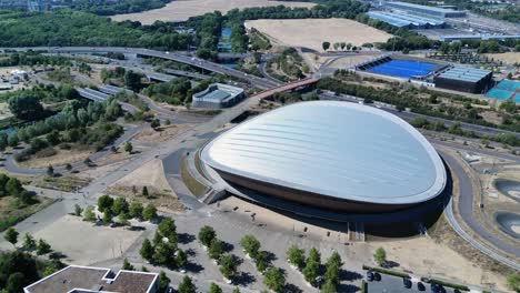 london aquatics centre with landscaped garden, stratford futuristic landmark aerial orbiting view