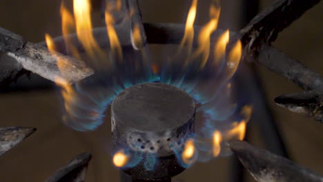 a close up flames from of an outdoor gas burner in slow motion