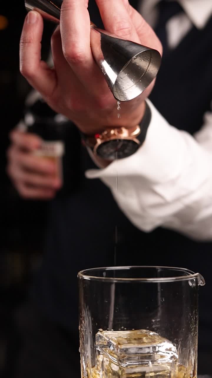Bartender making a whiskey cocktail
