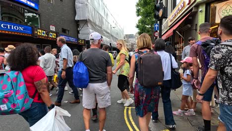 people walking on a busy london street