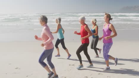 senior women running on the beach