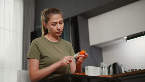 woman peeling a pepper