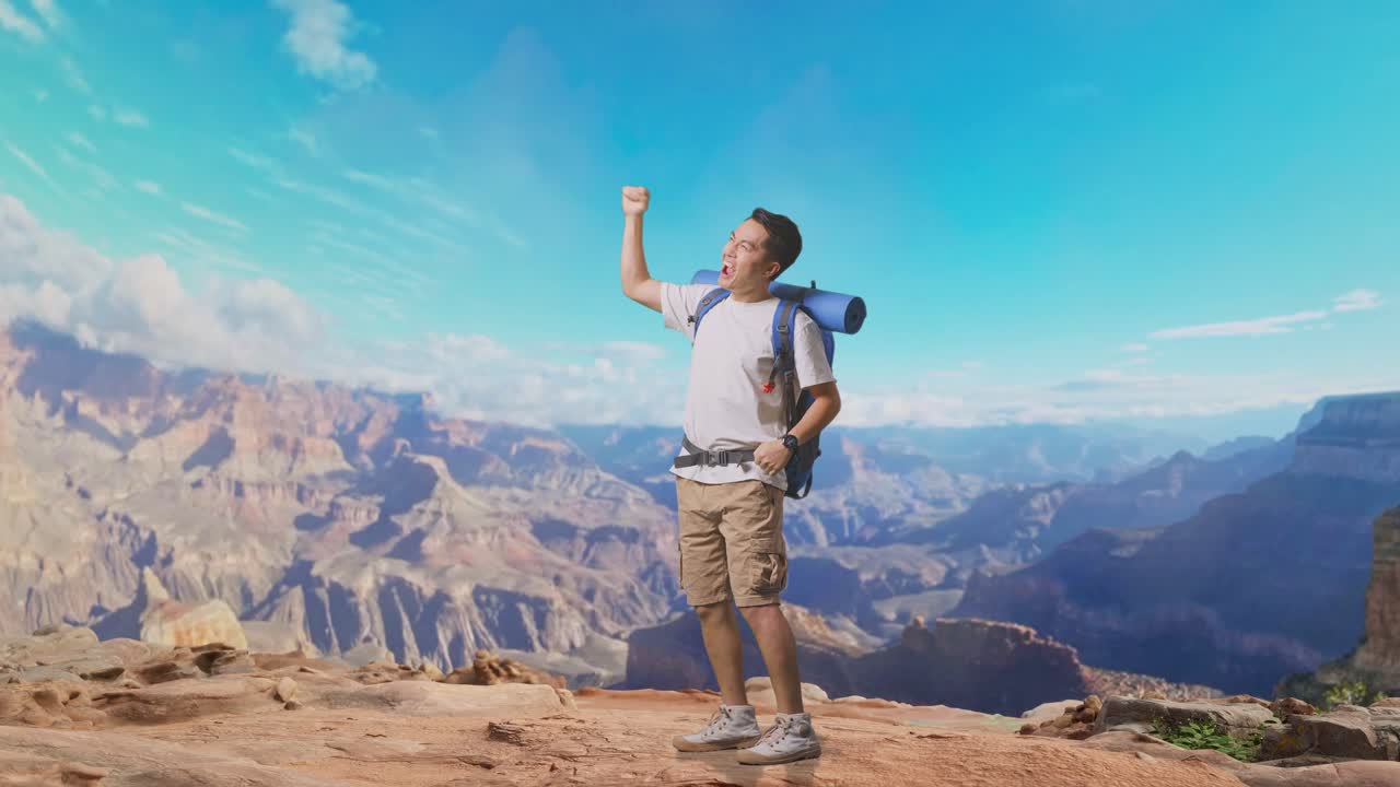 Full Body Side View Of Asian Male Hiker With Mountaineering Backpack Screaming Goal Celebrating The Success While Traveling At The Top Of Mountain