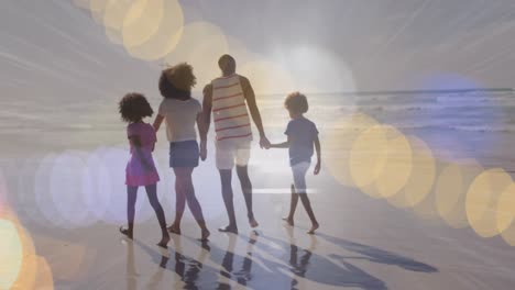 animation of light spots over african american family walking together