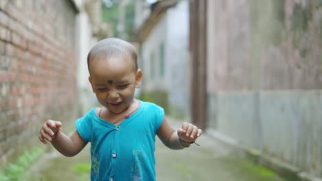 A child is having fun playing alone on the street
