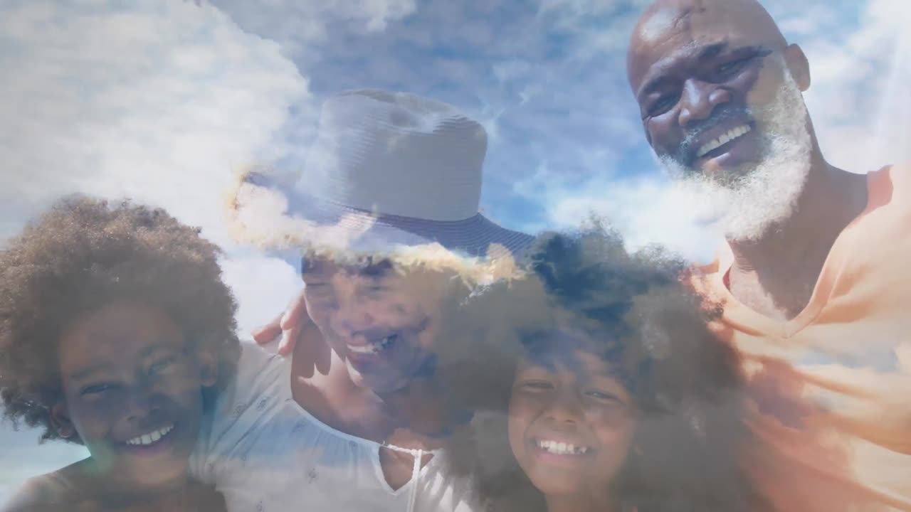 Animation of happy african american family embracing at beach over clouds