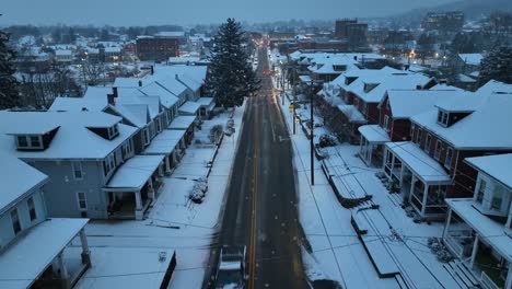 small town in usa during snow flurries at dawn