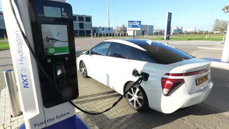 nxt hydrogen fuel station, sustainable mobility in alkmaar. refueling a car at the tank station.