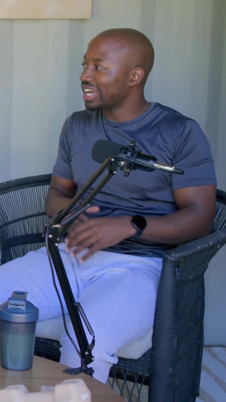 Vertical video: Recording starting man in sports tee talking and gesturing with laptop mic at home