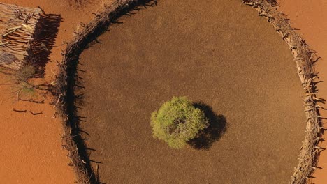 Rising-aerial-over-a-Himba-African-tribal-settlement-and-family-compound-in-northern-Namibia-Africa