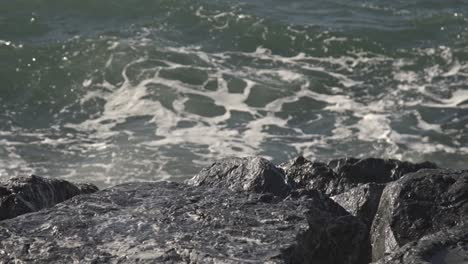 view of waves breaking on reef and rocks 4k uhd