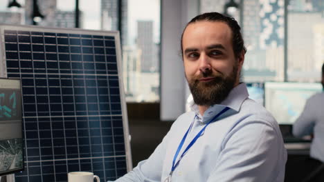 portrait of happy sustainable energy researcher using simulation software