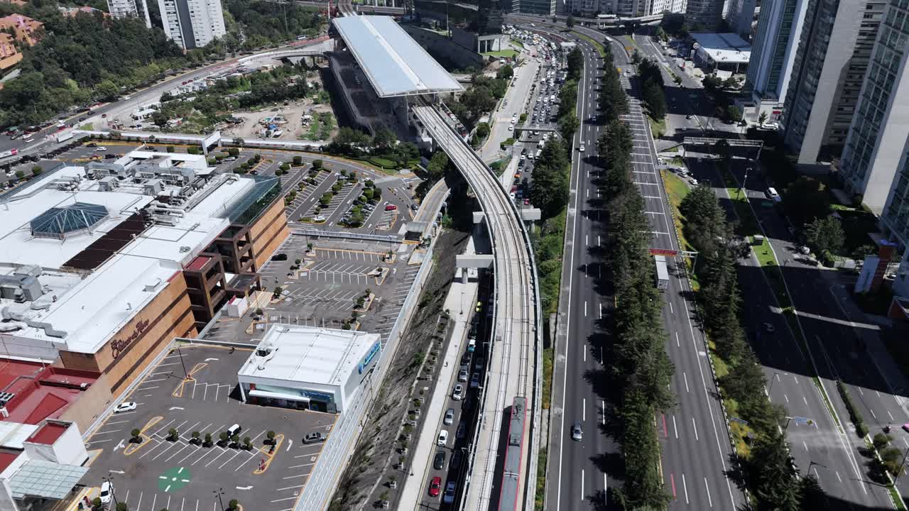 Aerial View of City with Highway Traffic and Train