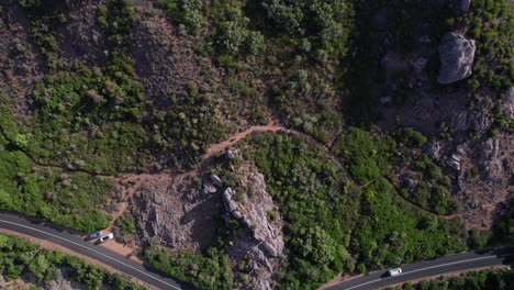 Aerial-backwards-reveal-of-bush,-road-and-coastline-of-Eagle-bay-in-Western-Australia