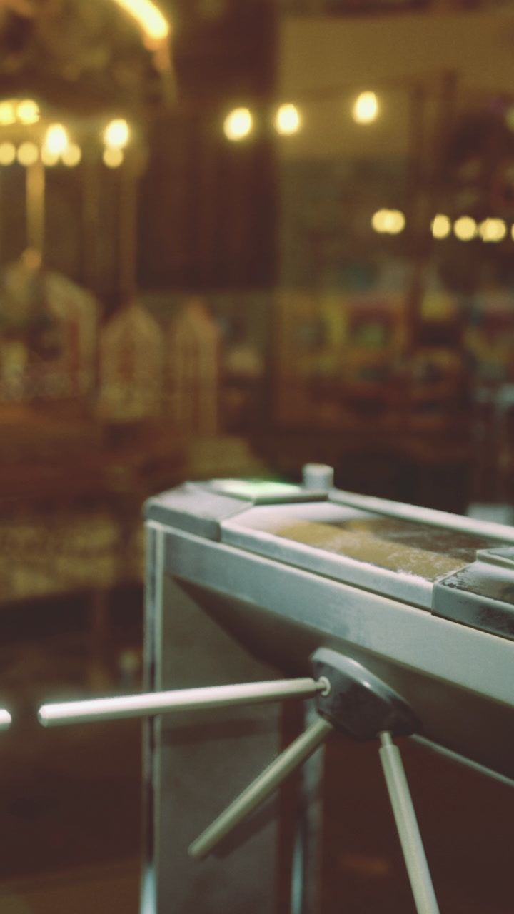 Mysterious turnstile welcoming visitors at a vibrant local fair