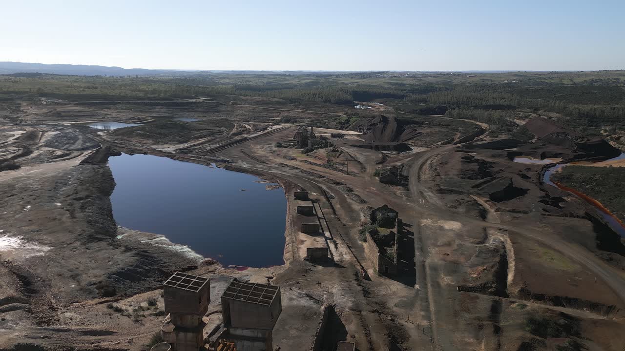 Abandoned copper mine buildings and flooded areas in the Sao Domingo Mine area, Portugal