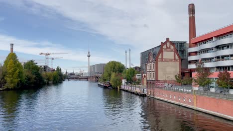 tv tower of berlin next to spree river an panoramic cityscape view