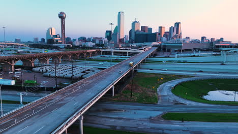 a highway leading into downtown an an early morning, shot on dji mavic 3