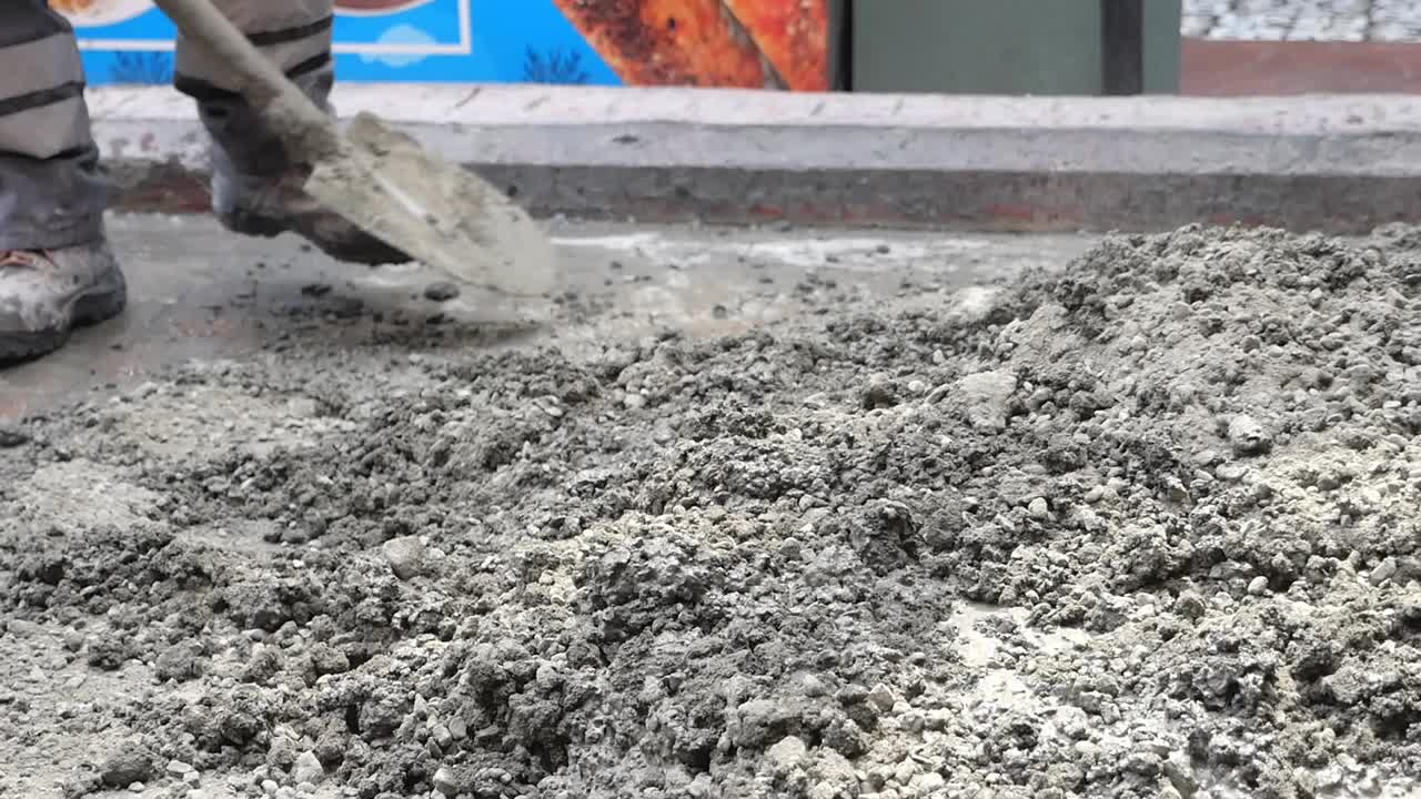 Construction Work with Concrete and Shovels