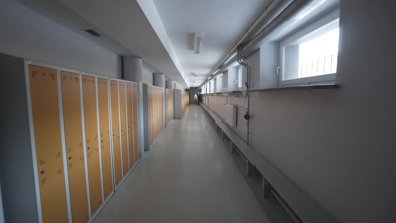 Long Empty School Corridor with Lockers