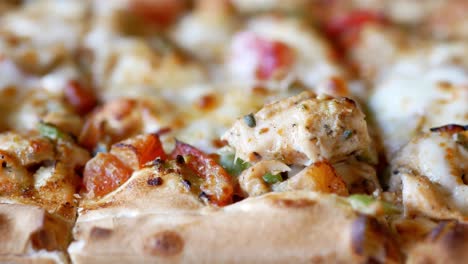 close-up of a delicious chicken pizza slice