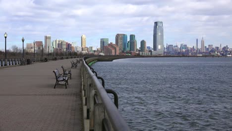 hoboken new jersey with benches and the hudson river waterfront